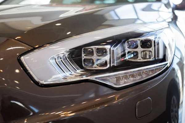 New modern car with elegant quadrate head lamps. Front view. — Stock Photo, Image