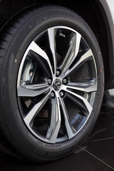 Russia, Izhevsk - July 21, 2019: Lexus showroom. The wheel with alloy wheel of a new RX350. Famous world brand. — Stock Photo, Image