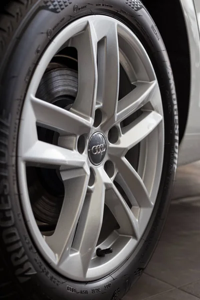 Russia, Izhevsk - September 11, 2019: Audi showroom. The wheel with alloy wheel of a new A4. Famous world brand. — Stock Photo, Image