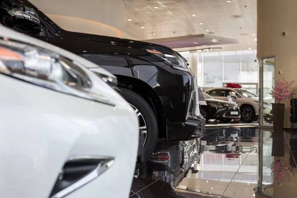 Car auto dealership.Themed blur background with bokeh effect. New cars at dealer showroom.