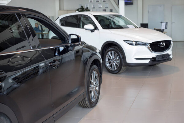 Russia, Izhevsk - August 06, 2020: New modern cars in the Mazda showroom. Famous world brand. Prestigious vehicles.