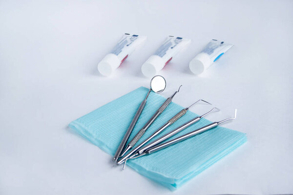 Tools and accessories for dental care and treatment. Isolated on white background. Copy space for your text.