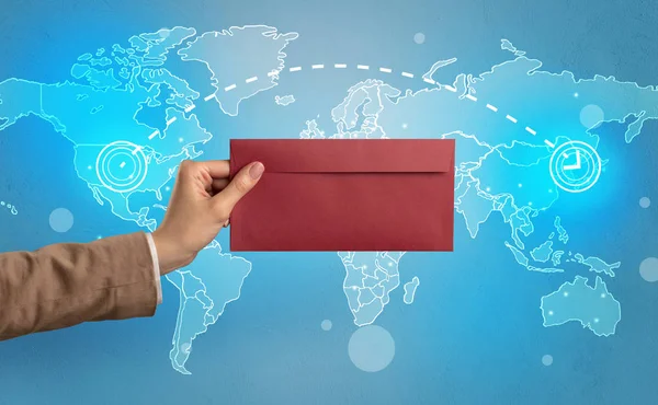 Hand holding envelope with global concept — Stock Photo, Image