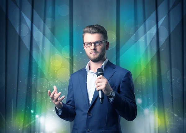 Businessman holding microphone — Stock Photo, Image