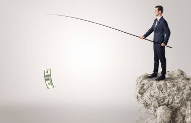 İşadamı Balık tutma Doları bir rock