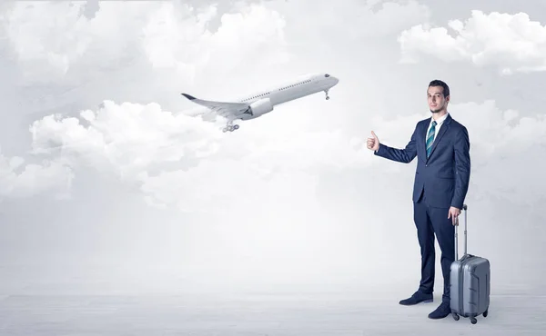 Agent hitchhiking with departing plane concept — Stock Photo, Image