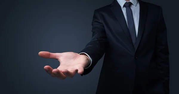 Businessman handing something without concept — Stock Photo, Image