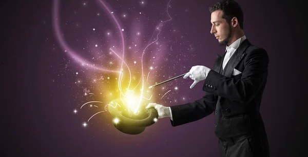 Magician hand conjure miracle from cylinder — Stock Photo, Image