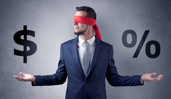 Man with ribbon on his eye holding dollar signs — Stock Photo, Image