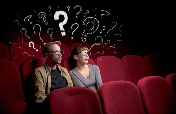 Couple in cinema with questions