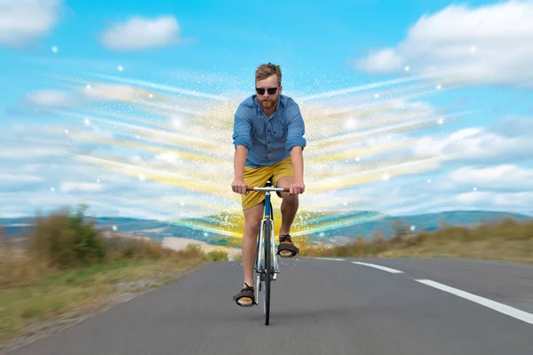 Young riding bicycle in nature — Stock Photo, Image