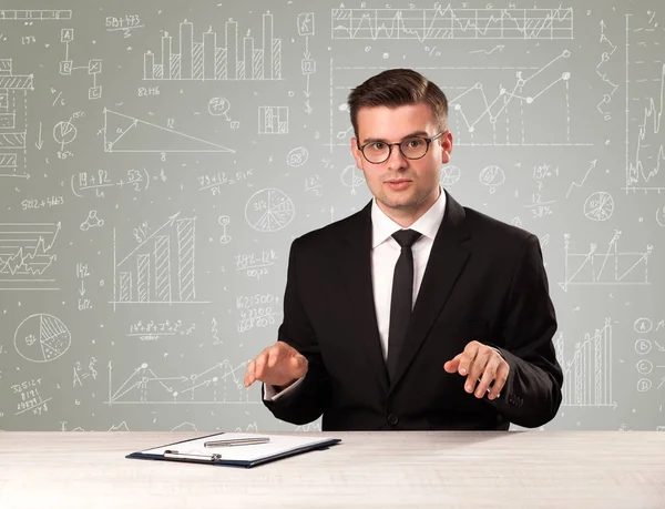 Businessman sitting at a desk — Stock Photo, Image