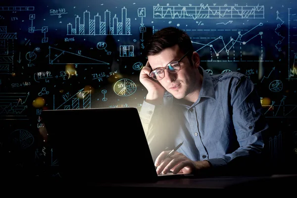 Businessman in the office at night — Stock Photo, Image