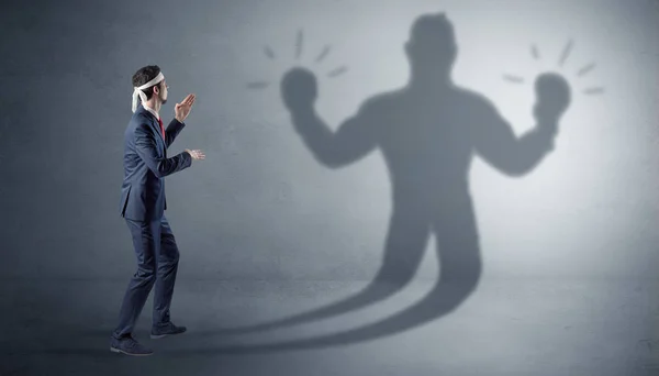 Empresário lutando com sua sombra desarmada — Fotografia de Stock