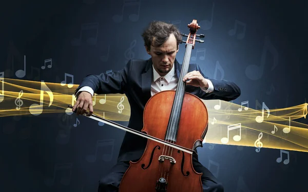 Musician playing on cello with notes around — Stock Photo, Image