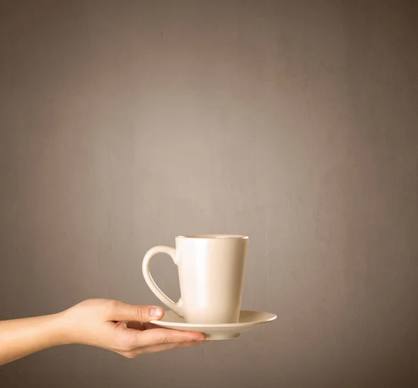 Female hand holding tea mug — Stock Photo, Image