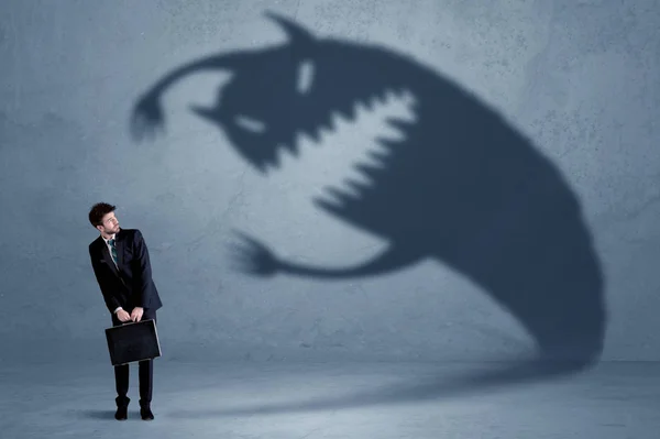Business man afraid of his own shadow monster concept — Stock Photo, Image