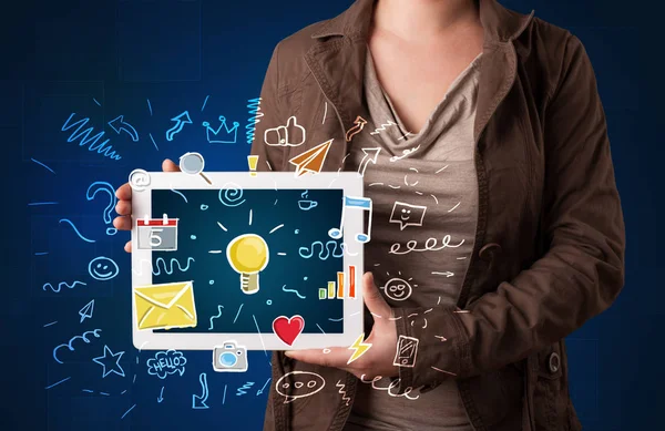 Woman holding tablet with applications — Stock Photo, Image