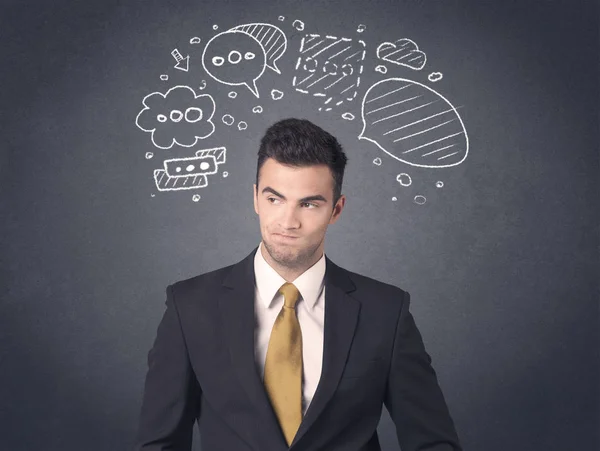 Hombre de negocios con burbujas de habla — Foto de Stock