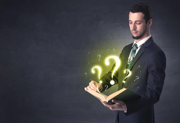 Businessman looking in a book. — Stock Photo, Image