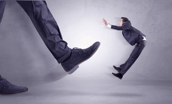 Foot kicking, businessman flying — Stock Photo, Image