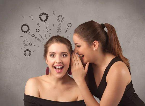 Girl telling secret things to her girlfriend — Stock Photo, Image