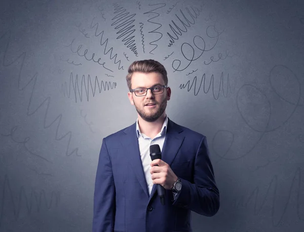 Businessman holding microphone — Stock Photo, Image