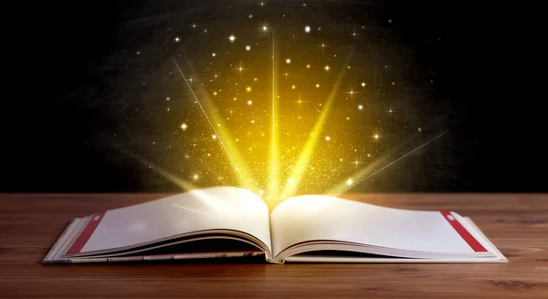 Yellow lights over book — Stock Photo, Image