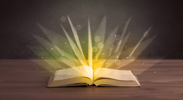 Yellow lights spreading from an open book