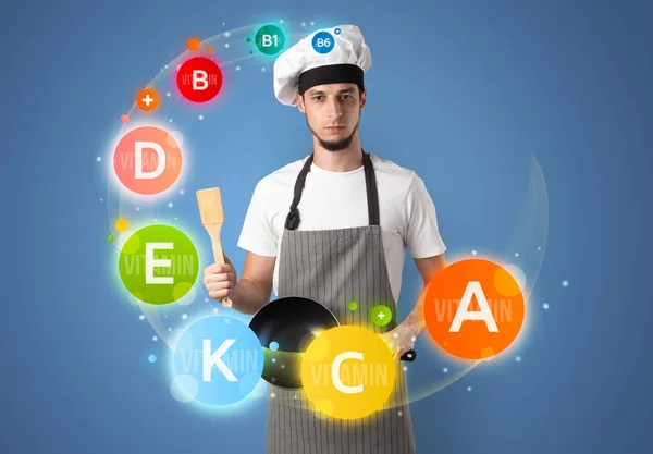 Handsome cook with vitamin concept — Stock Photo, Image