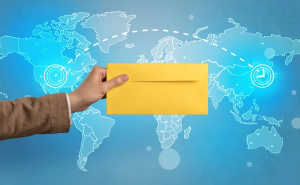 Hand holding envelope with global concept — Stock Photo, Image