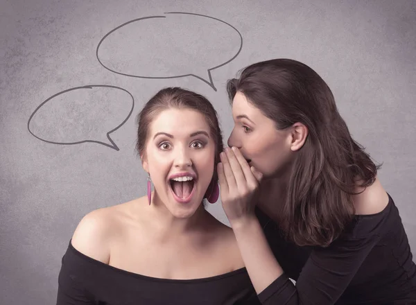 Girl telling secret things to her girlfriend — Stock Photo, Image