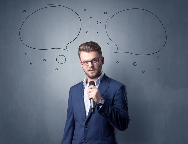 Businessman holding microphone — Stock Photo, Image