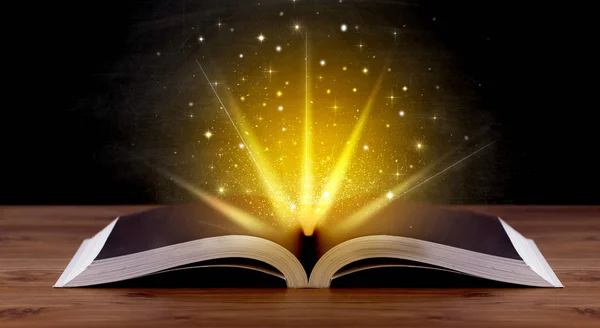 Yellow lights over book — Stock Photo, Image