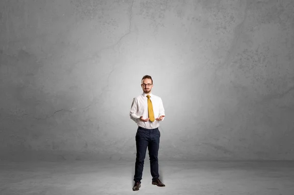 Alone businessman standing in a dark room — Stock Photo, Image