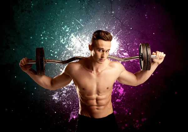 Attractive musculous guy lifting weight — Stock Photo, Image