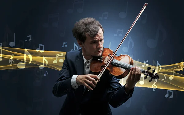 Musician playing on violin with notes around — Stock Photo, Image