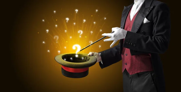 Magician conjure question signs from a cylinder — Stock Photo, Image