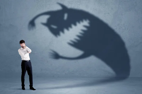 Business man afraid of his own shadow monster concept — Stock Photo, Image