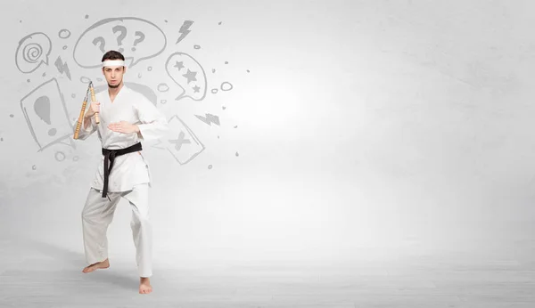 Karate trainer fighting with doodled symbols concept — Stock Photo, Image