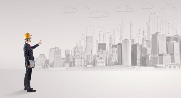 Architect standing and  replanning a city panorama