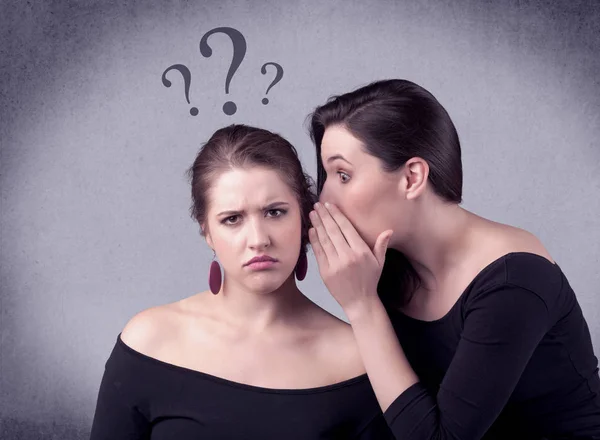 Girl telling secret things to her girlfriend — Stock Photo, Image