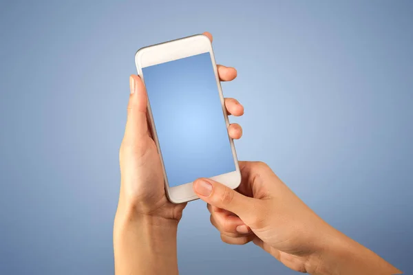 Female hand holding smartphone — Stock Photo, Image