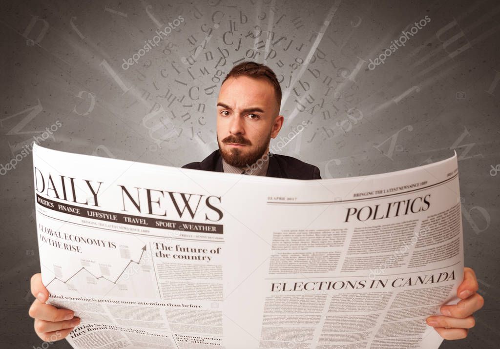 Businessman reading newspaper