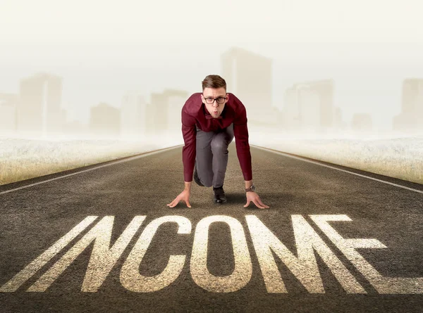 Businessman kneeling in ready position — Stock Photo, Image