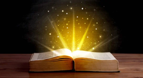 Yellow lights over book — Stock Photo, Image