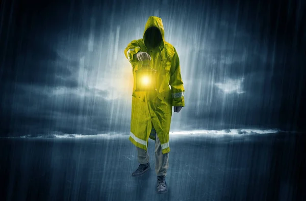 Man walking in storm with lantern