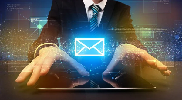 Businessman typing and mailing icon above — Stock Photo, Image