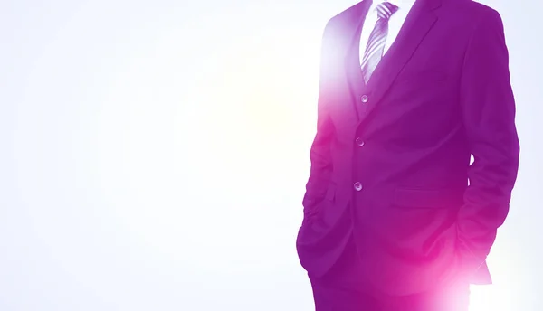 Young businessman standing and thinking — Stock Photo, Image