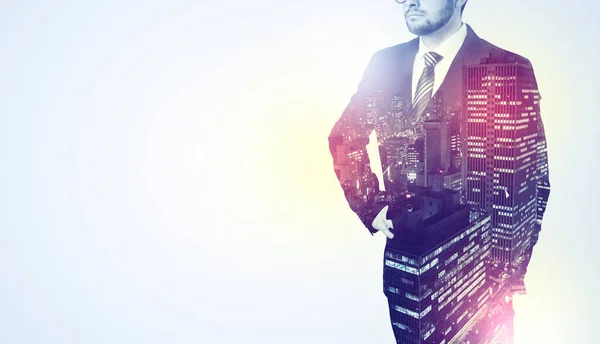 Businessman standing with night city graphic — Stock Photo, Image